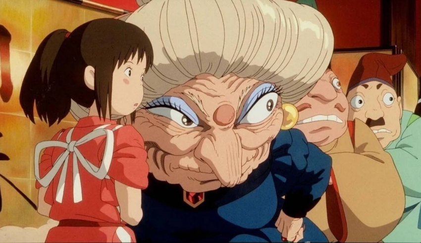 A group of people are standing around an old woman.