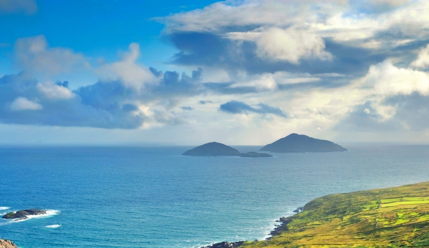 A view of the ocean from a hillside in ireland.