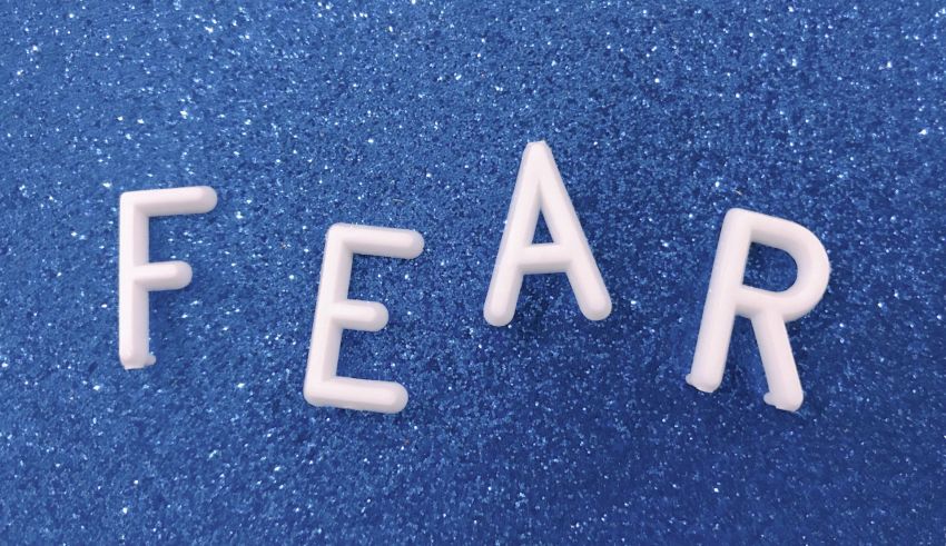 The word fear spelled out on a blue background.