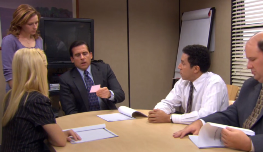 A group of people sitting around a table.