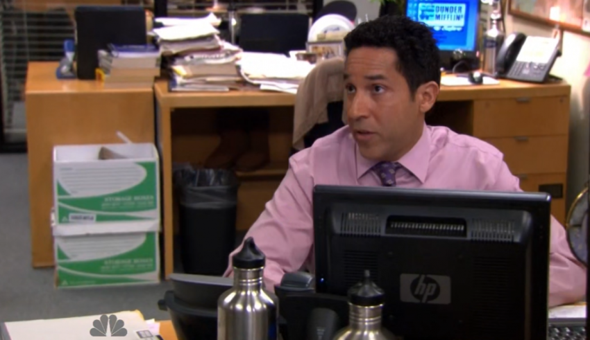 A man sitting at a desk in an office.