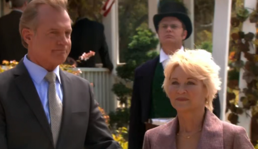 A man in a suit and a woman in a dress.