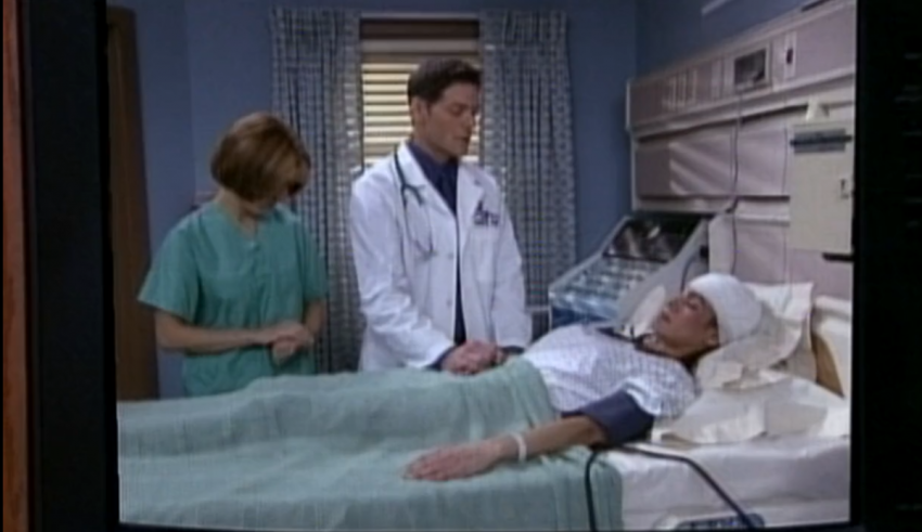 A television showing a man in a hospital bed.