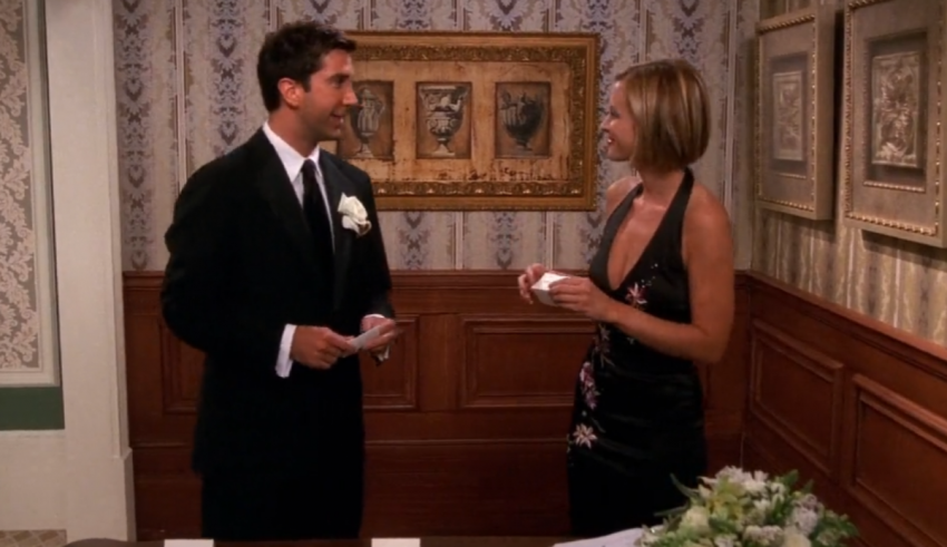 A man and woman standing next to each other in a room.