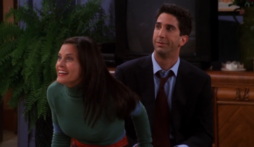 A man and woman sitting next to each other in a living room.