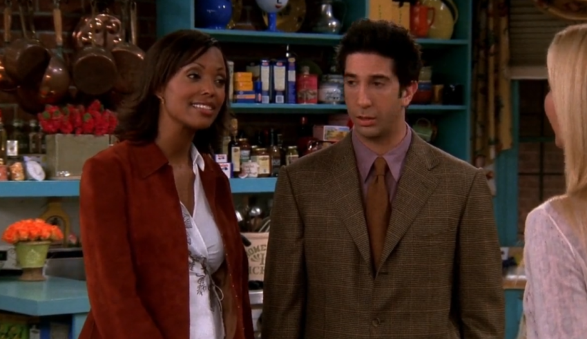 A man and a woman standing in a kitchen.