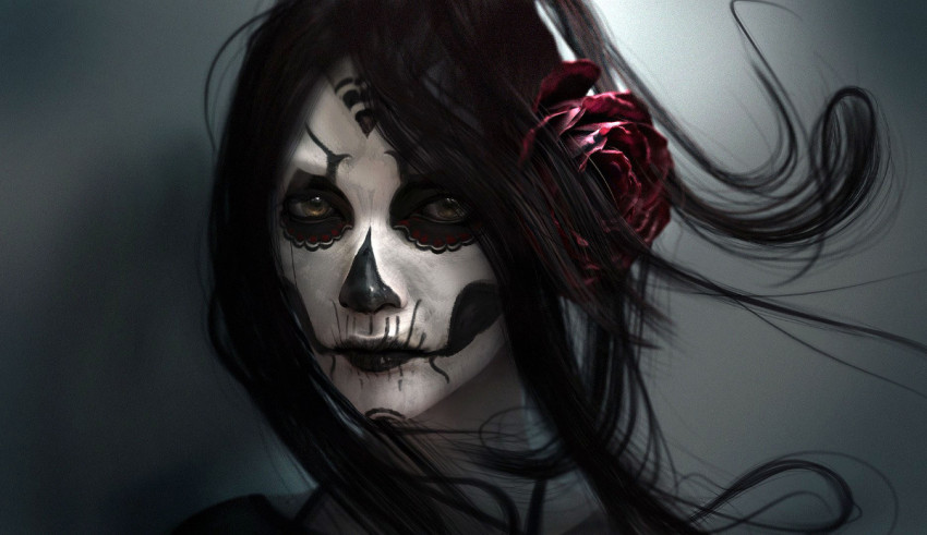 A woman with sugar skull makeup on her face.