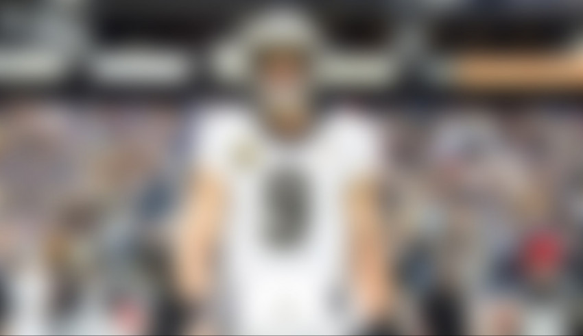 An image of a football player standing in front of a crowd.