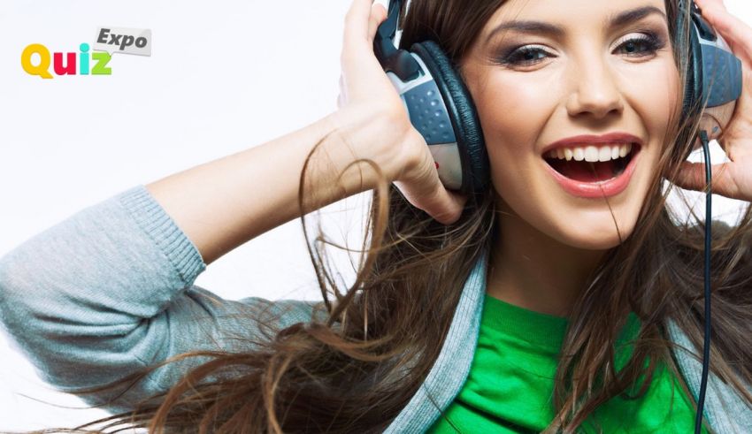 A woman wearing headphones and smiling.