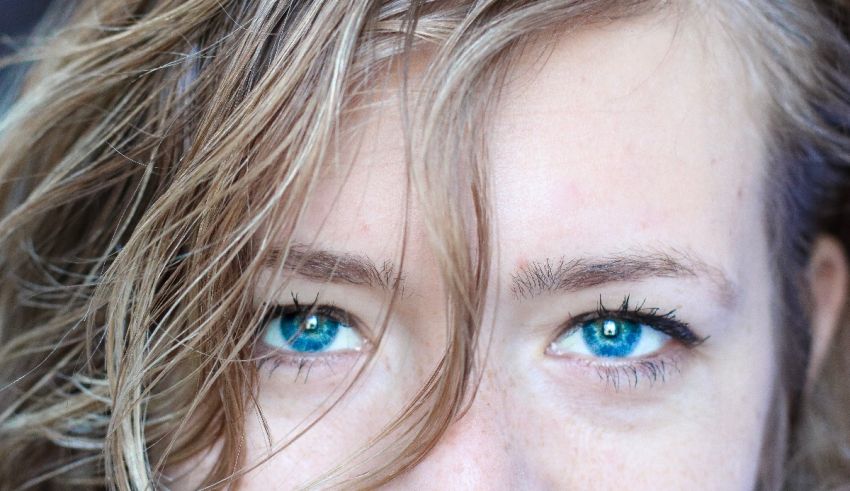 A close up of a woman with blue eyes.