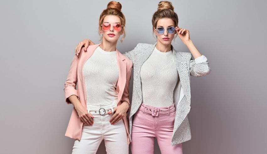 Two young women in pink and white clothes posing for a photo.