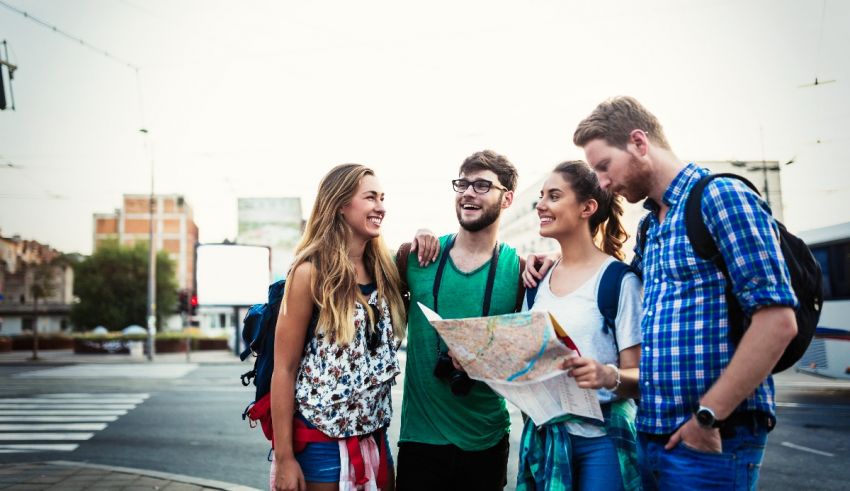 A group of young people looking at a map.