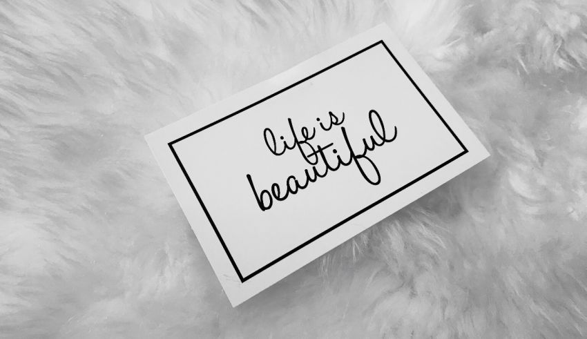 A black and white sign that says life is beautiful.