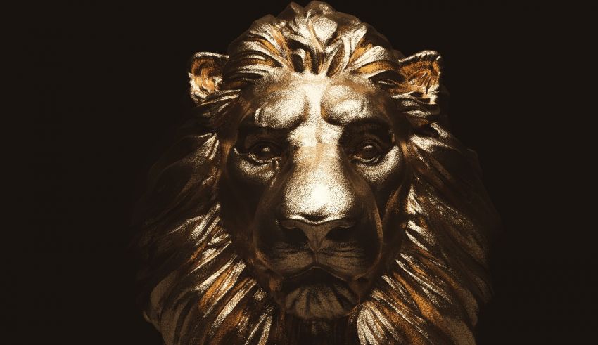 A golden lion head on a black background.