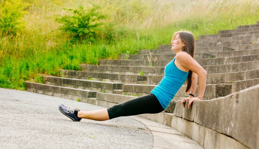 A woman doing an exercise on a set of steps.