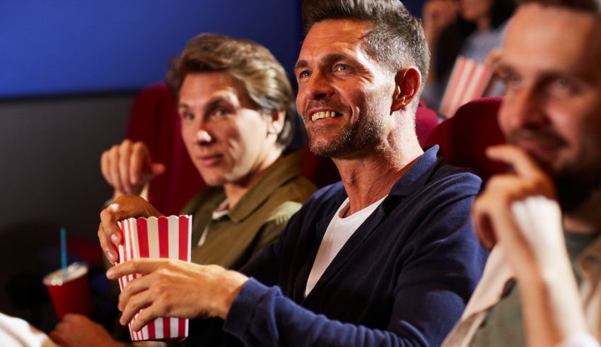 A group of people watching a movie in a cinema.