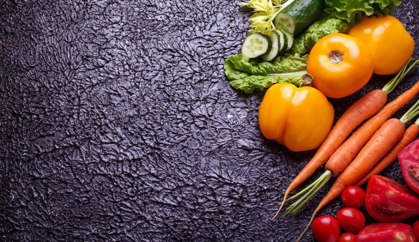 Fresh vegetables on a black background.