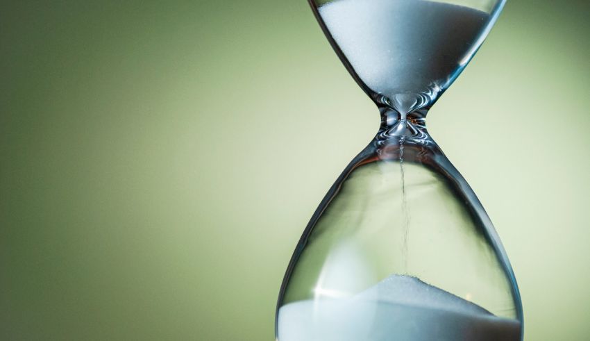 An hourglass with sand in it.