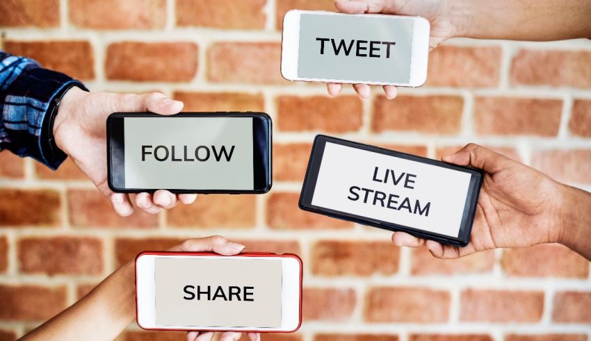 A group of people holding tablets with the words twitter, live stream, and facebook.