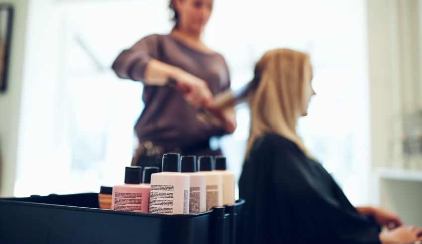 A woman is getting her hair done in a salon.