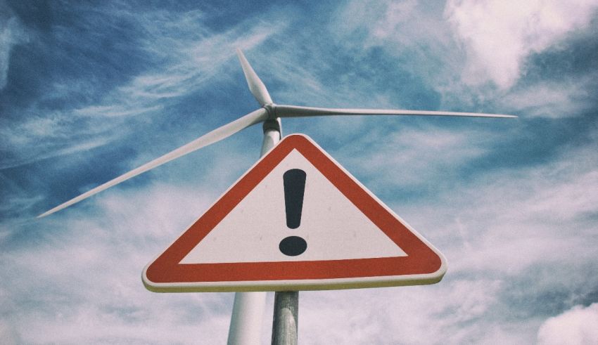 A wind turbine in the background.