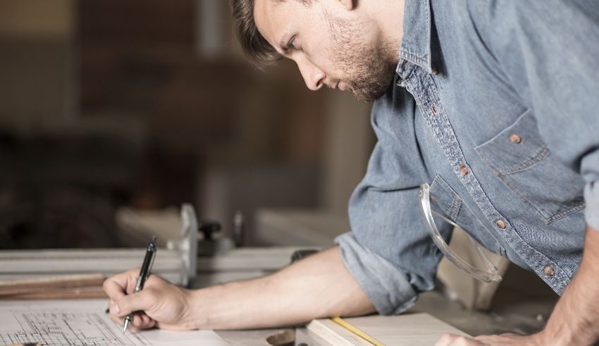A man is working on a piece of wood.
