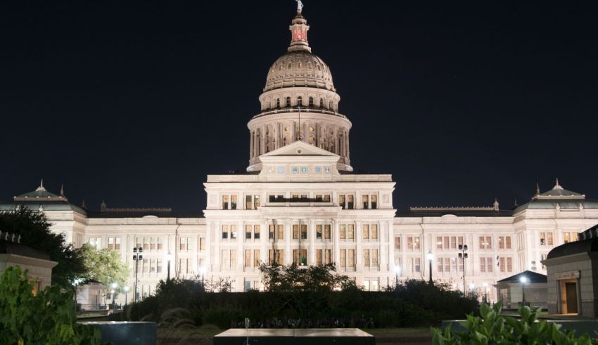 The capitol building is lit up at night.