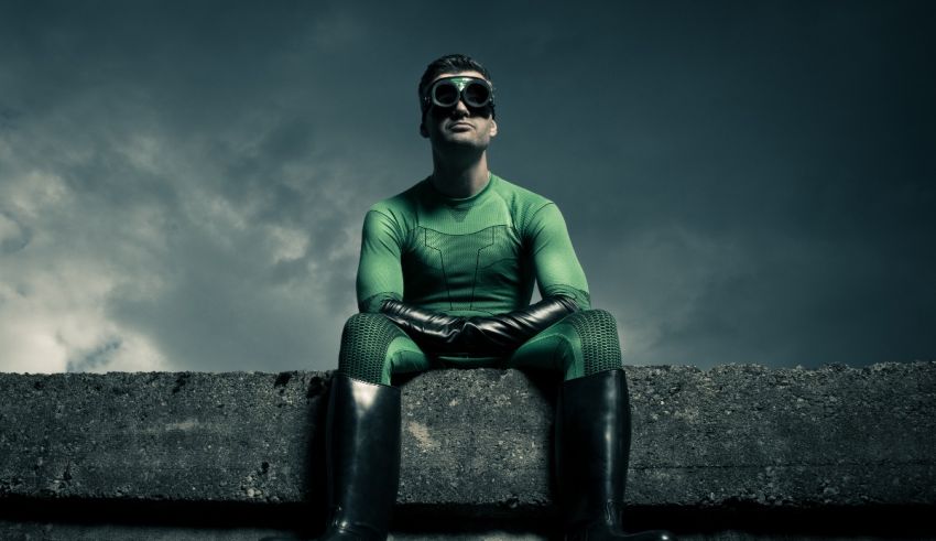 A green lantern sitting on a concrete wall.