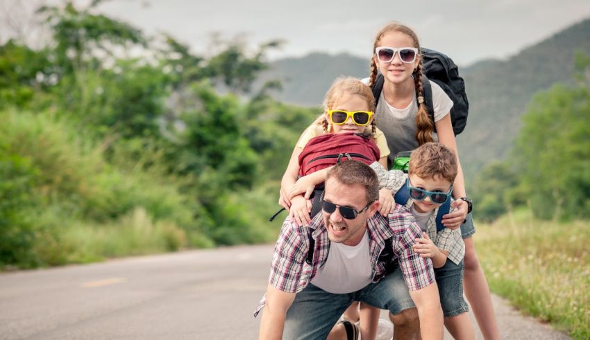 A family is riding on a road with a backpack.