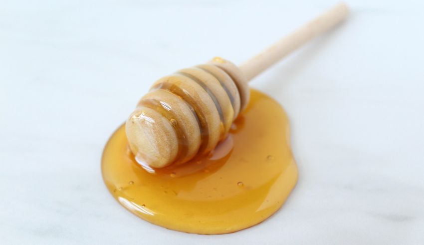 Honey on a wooden stick.