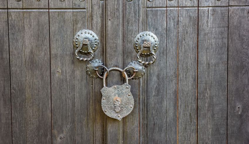 A padlock on a wooden door.