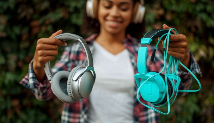 A woman is holding headphones and listening to music.