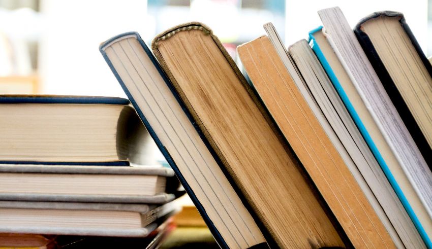 A stack of books on a table.