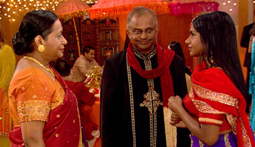 Two women in saris talking to each other.