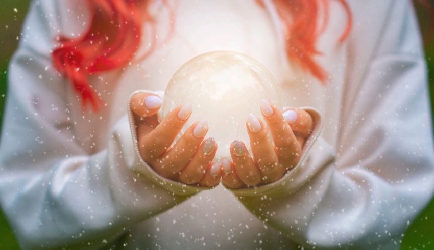 A woman holding a crystal ball in her hands.