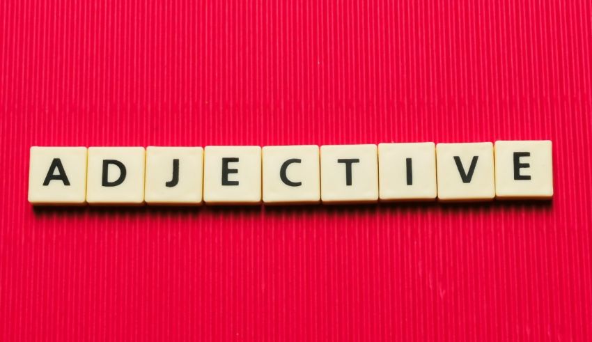 The word adjective spelled out on a red background.