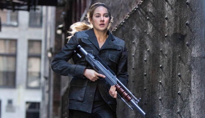 A woman with a gun walking down an alley.