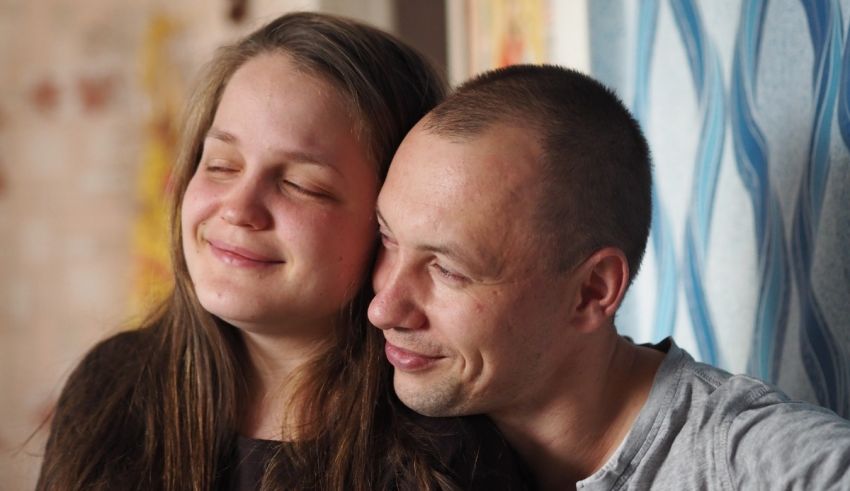 A young man and woman are looking at each other.