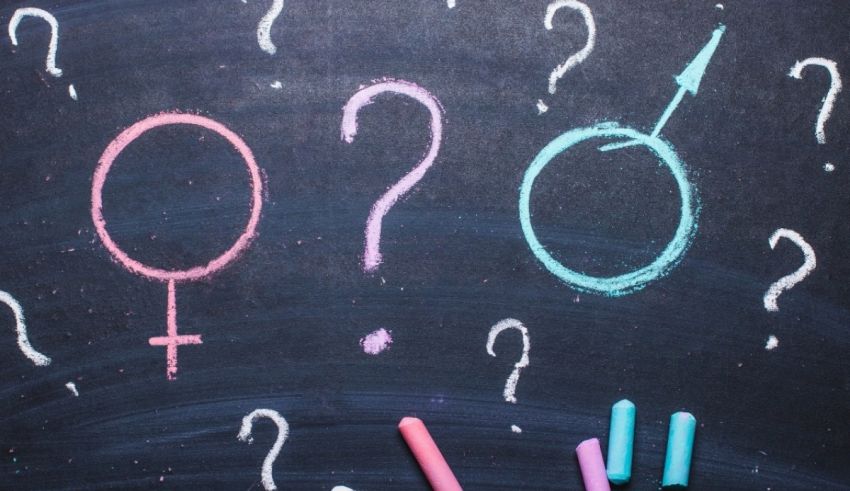 A chalkboard with female and male signs drawn on it.