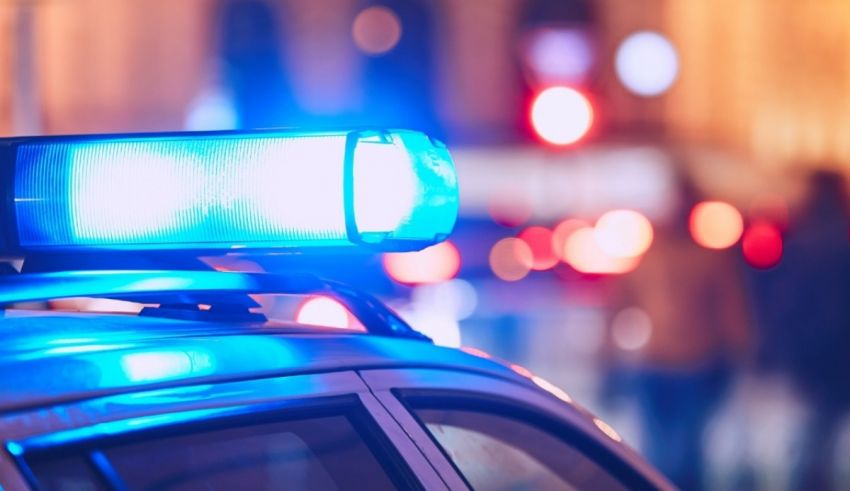 A police car with lights on top of it at night.
