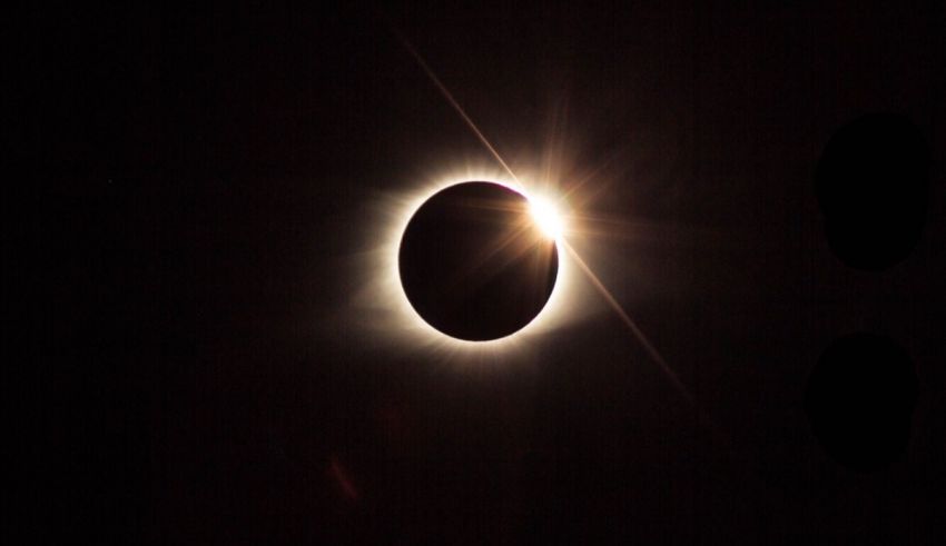 A solar eclipse is seen in the dark sky.