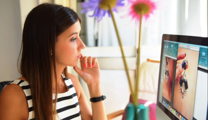 A woman looking at her computer screen.