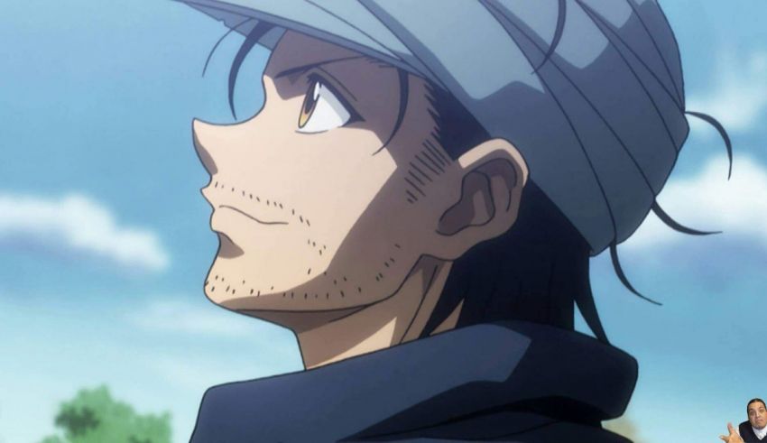 A man in a hat is looking up at the sky.