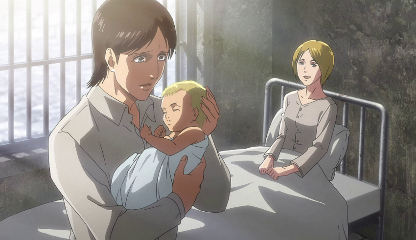 A man and woman holding a baby in a hospital bed.