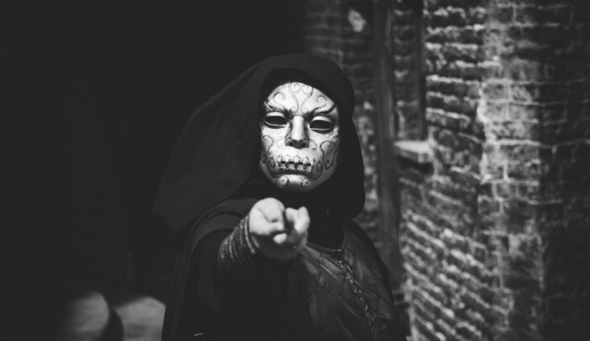 A black and white photo of a woman with a skeleton face.