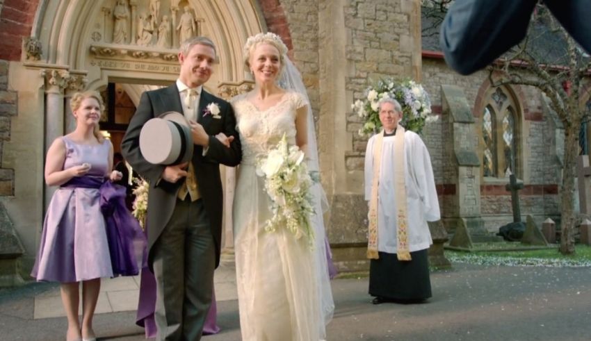 A bride and groom walking down the aisle of a church.