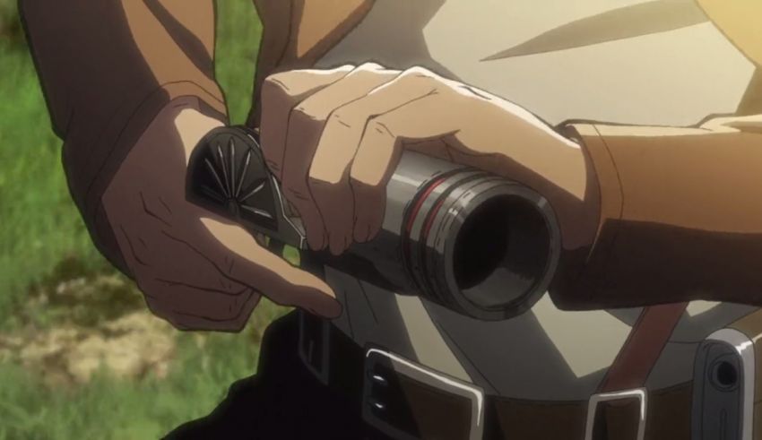 A man holding a gun in a field.