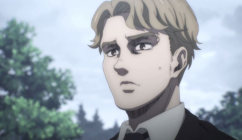 A man in a suit and tie is staring at the camera.