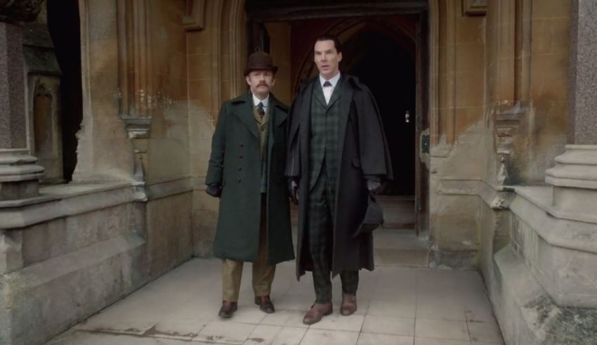 Two men in coats standing in front of a building.