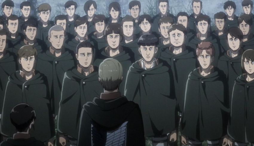 A group of people standing in front of a group of people.